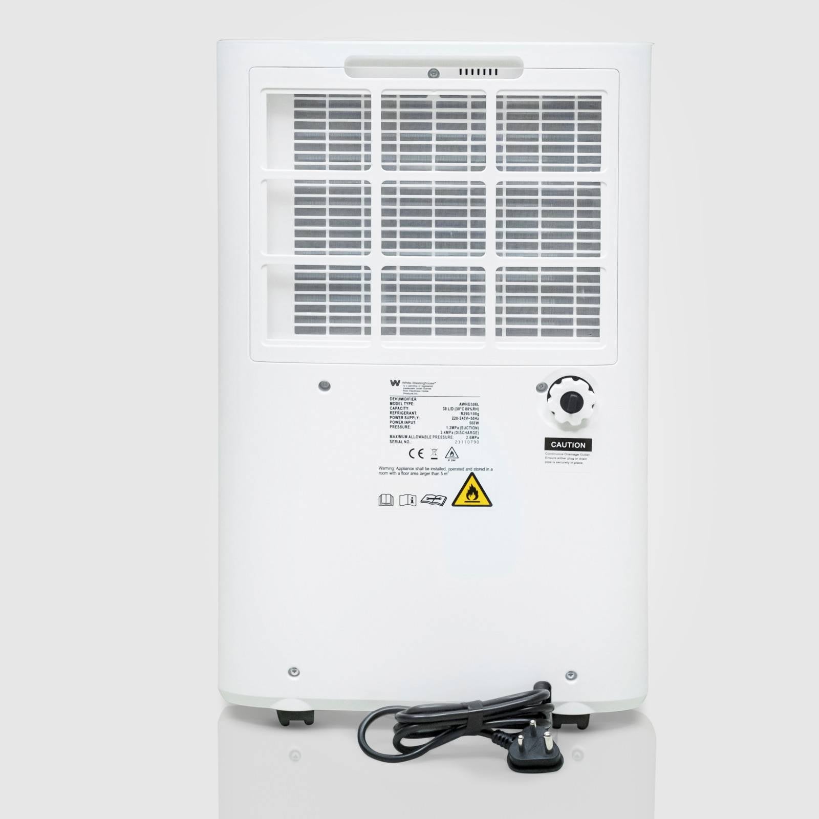 The back view of a white dehumidifier, showing a large air vent for exhaust and a coiled power cord at the bottom. The device has certification labels and warnings on the back panel, along with a control knob. The unit is on small wheels for easy mobility.