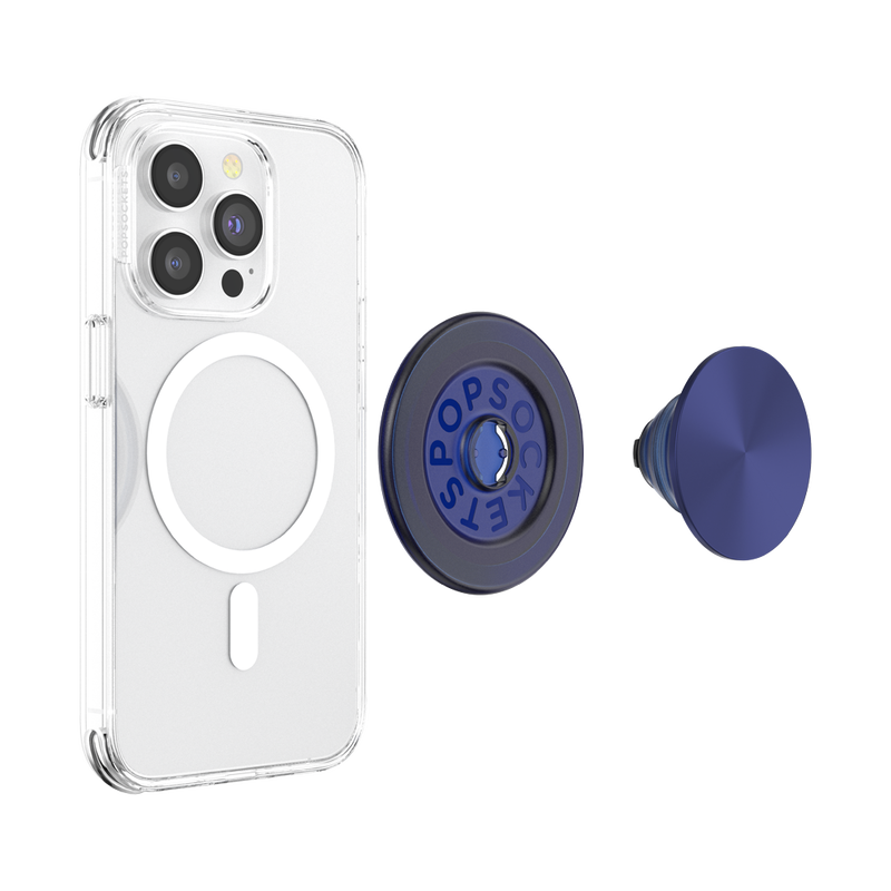 A smartphone with a clear case is shown next to a disassembled French Navy PopGrip for MagSafe. The phone's back displays the MagSafe alignment ring, indicating its compatibility with MagSafe accessories. The PopGrip is separated into two parts: the round base with the PopSockets logo and the extendable grip with a glossy navy blue surface. The clear case allows visibility of the phone's details and the MagSafe ring, highlighting the PopGrip's stylish and functional design.
