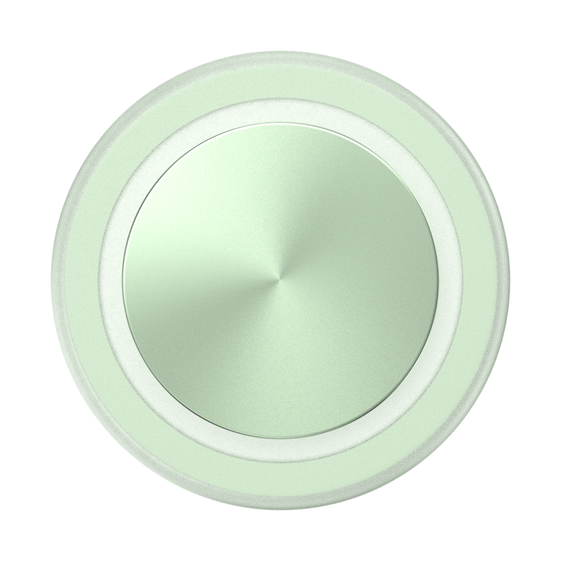 A close-up view of a French Navy PopGrip for MagSafe in honey dew color is shown. The grip features a round, flat surface with a glossy, slightly reflective finish. The soft green color and the concentric circular design give the PopGrip a fresh and modern appearance, emphasizing its sleek and functional design.
