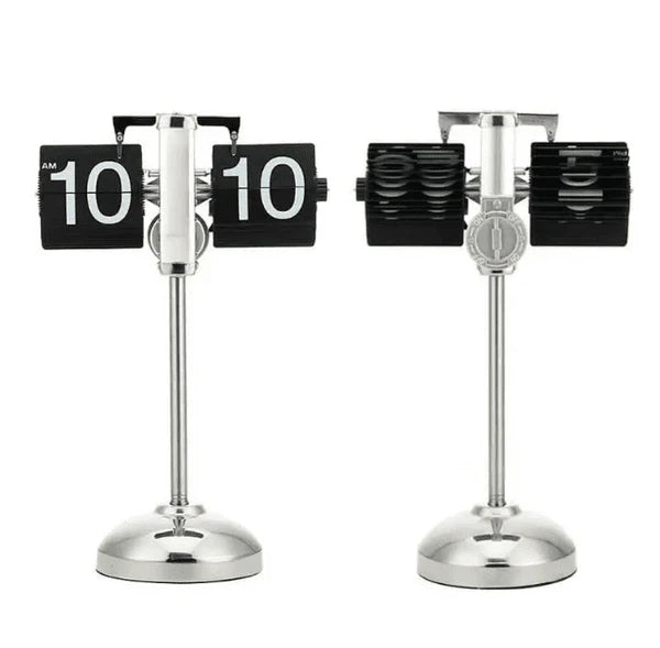 Two vintage-style flip clocks with chrome stands are placed side by side against a plain white background. Both clocks display the time "10:10" with black and white flip cards. The clock on the left shows the front view, highlighting the time display, while the clock on the right shows the rear view, revealing the mechanism and the flip cards. Both clocks have a sleek, retro design with shiny chrome bases and stands.