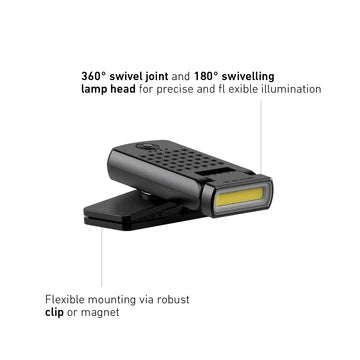 A compact black LED clip light with a long, narrow LED strip at the front is shown in a promotional image. The text highlights the light's features, stating "360° swivel joint and 180° swiveling lamp head for precise and flexible illumination" and "Flexible mounting via robust clip or magnet." The image demonstrates the light's ability to adjust its angle and mount securely.