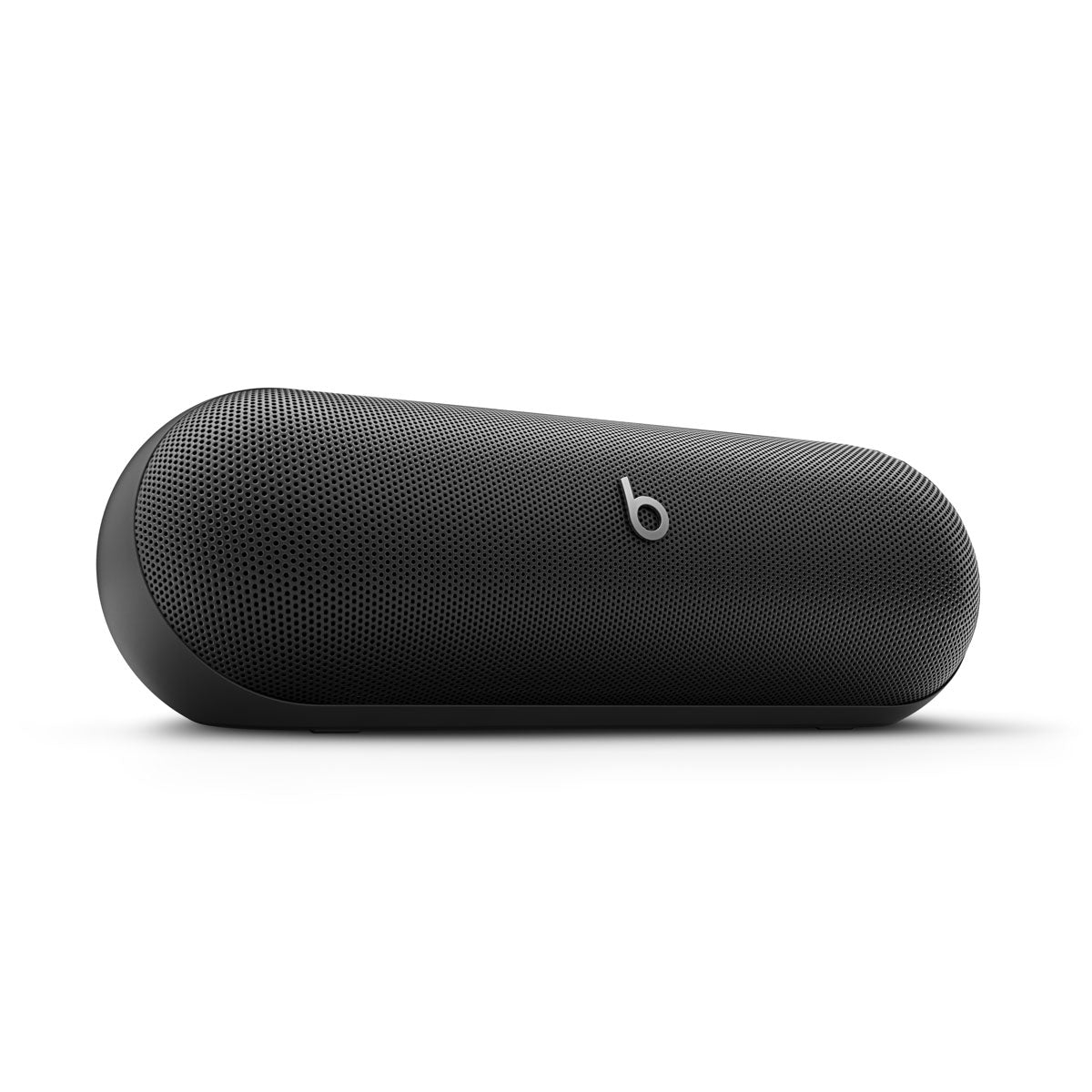 Alt text for this image:
A close-up view of a black Beats portable speaker showcasing its sleek, modern design with the iconic Beats logo in the center, highlighting its minimalist and premium build.