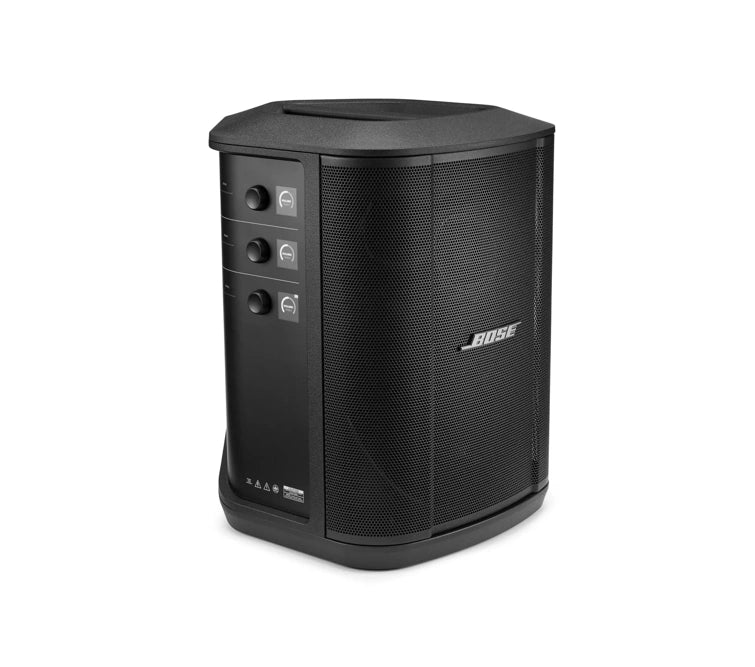 Angled front view of a black Bose speaker with a sleek, curved design. The front grille prominently displays the Bose logo. The side panel features three knobs for adjusting volume, treble, and bass, each with corresponding icons and digital displays. The overall design is modern and functional, emphasizing portability and ease of use.