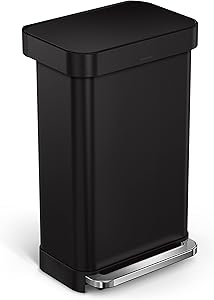 Sleek black rectangular trash can with a stainless steel foot pedal for hands-free operation. Designed with a modern, minimalist aesthetic, ideal for kitchens, offices, or home spaces.
