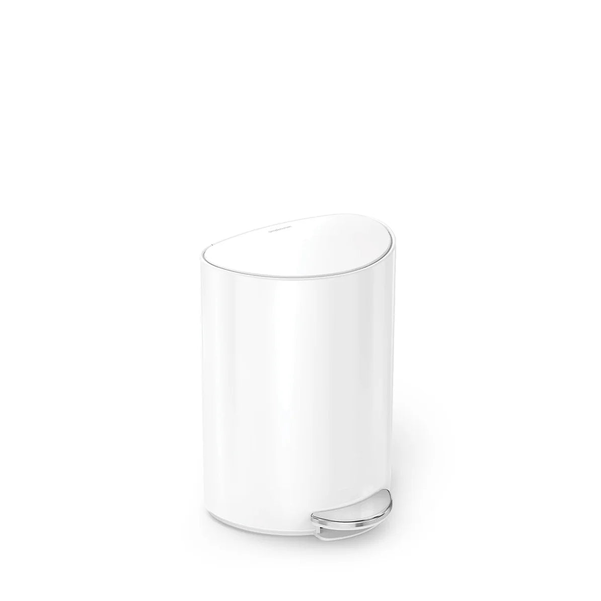 A small, white, oval-shaped trash can with a sleek and minimalist design. The trash can features a polished chrome pedal at the bottom, allowing for hands-free operation. The top of the can is slightly curved, giving it a modern and elegant appearance. The overall design is simple yet functional, making it a suitable addition to a contemporary bathroom or kitchen space.