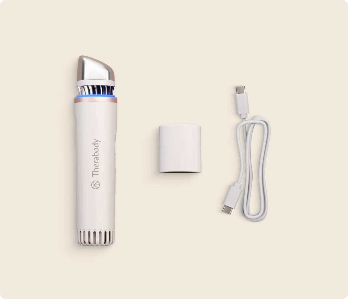 What's included with the white TheraFace Depuffing Wand: the device, travel cap and USB-C charging cable