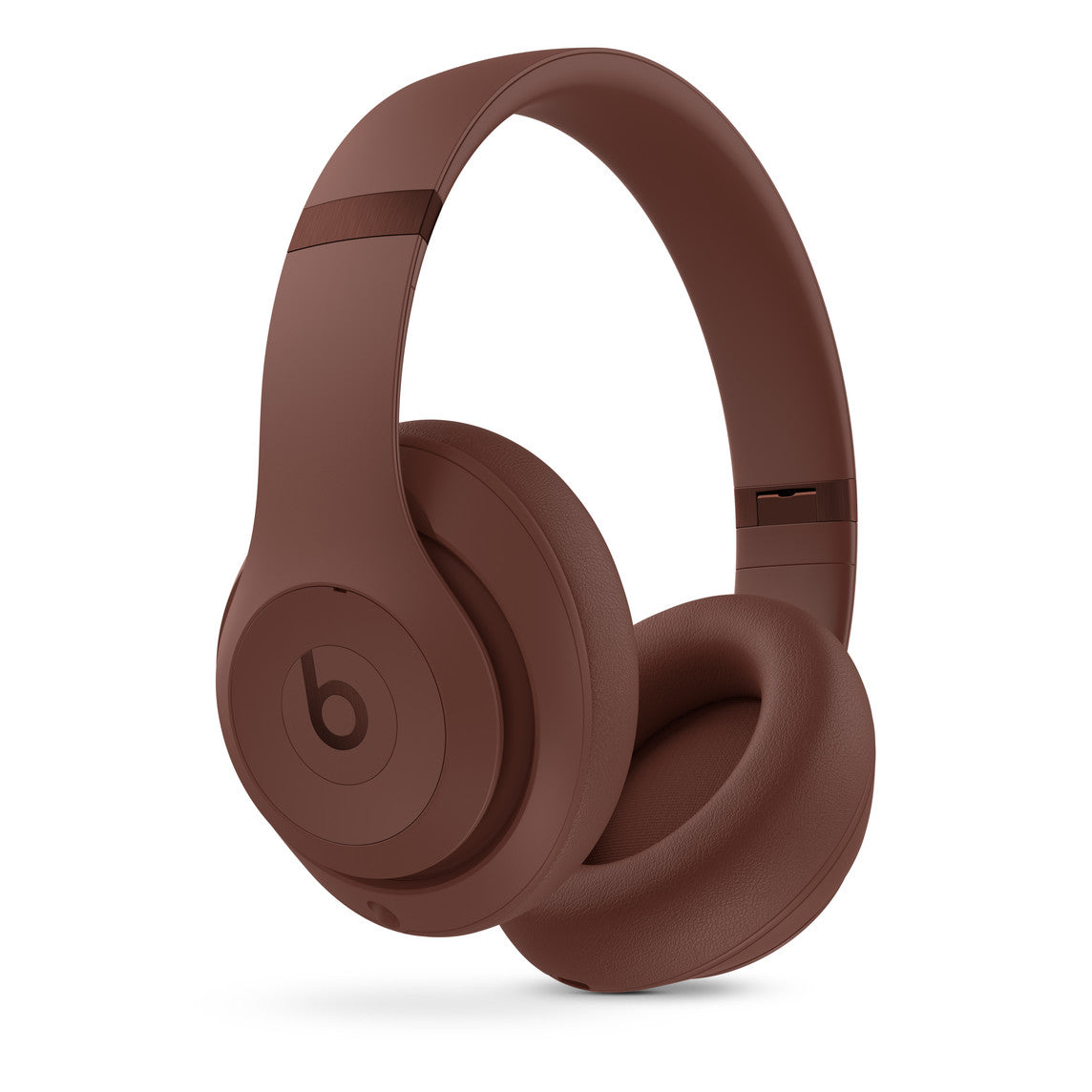 Brown over-ear wireless headphones featuring a modern design with a bold b logo on the ear cups, soft cushioned ear pads, and an adjustable headband for a comfortable fit.
