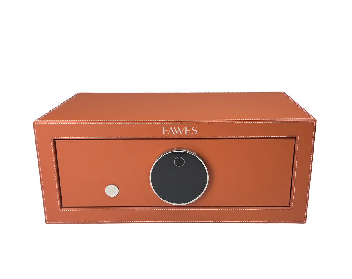 Front view of a FAWES security safe in tan leather finish with white stitching, featuring a large circular digital lock and a silver keyhole, combining luxury with secure storage.