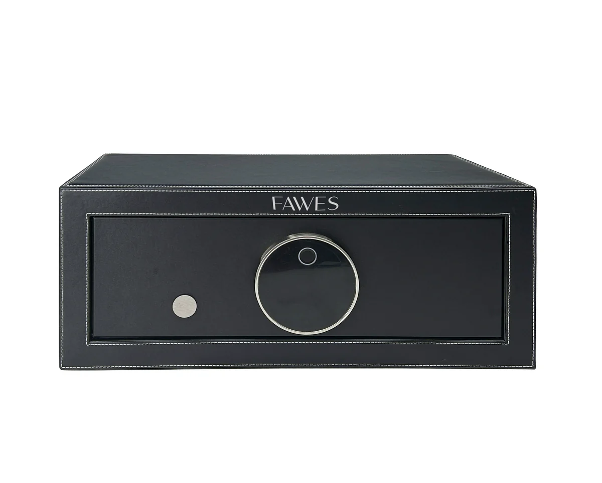 Front view of a FAWES security safe in black leather finish with white stitching, featuring a circular digital lock and a silver keyhole, designed for secure and stylish storage.