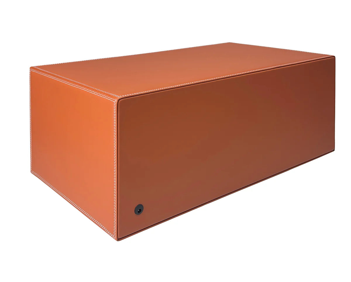 Rear view of a rectangular FAWES safe with a smooth tan leather finish, white stitching, and a power port located on the lower left corner.