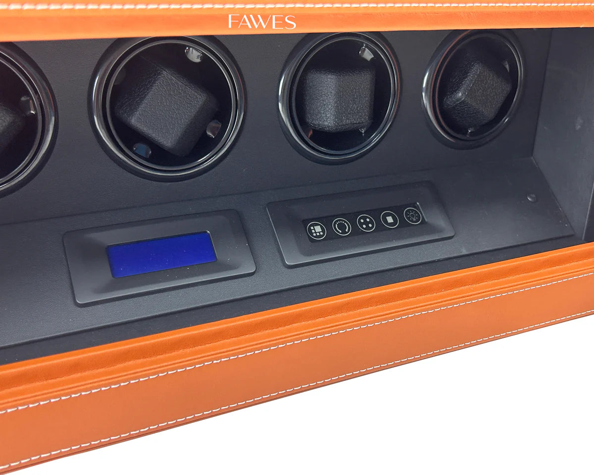 Close-up view of a FAWES watch winder safe interior, showcasing four individual watch holders, a digital display screen, and a touch control panel, all set in a black interior with a tan leather exterior and white stitching.