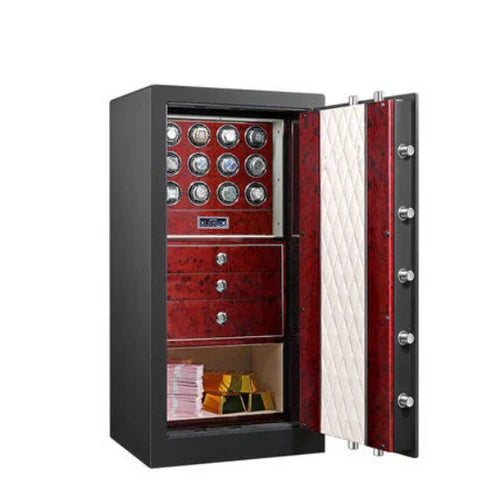 An elegant watch safe stands open, revealing its luxurious interior. The inside is lined with a rich red wood finish and features multiple rows of watch winders, each capable of holding and winding several watches. Below the watch winders are three drawers with chrome knobs for additional storage.