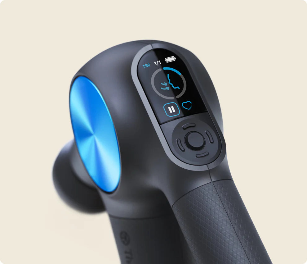 Close-up of a black massage gun with a metallic blue accent, featuring an LED screen displaying settings and a circular control pad for adjustments. The ergonomic handle has a textured grip.