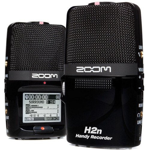 Two Zoom H2n Handy Recorders displayed side by side. The recorder on the left shows the front microphone grille and large LCD screen displaying recording information and audio levels, with the recording mode set to SURROUND.