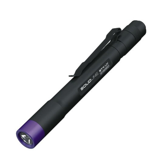 A black SOLIDline penlight with a purple accent near the LED light. The penlight has a clip attached for easy carrying, and the model name "ST4 UV" along with "395 nm UV" is printed on the side of the penlight.