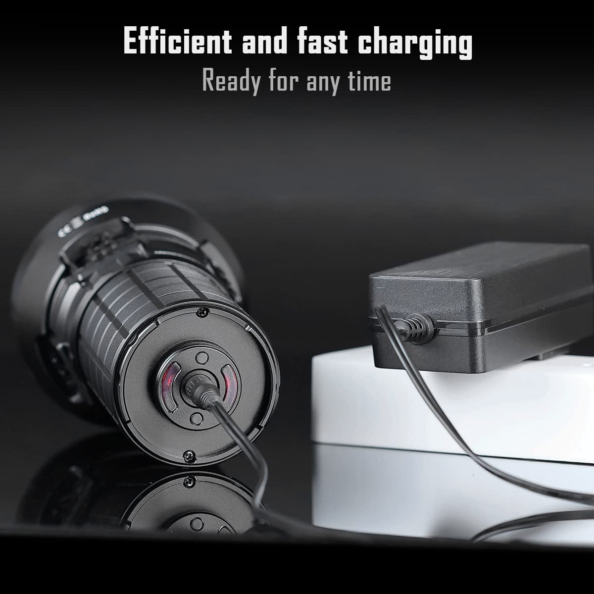 Image showing the IMALENT MS12 MINI flashlight being charged. The flashlight is connected to a power adapter via a charging cable, emphasizing its efficient and fast charging capability