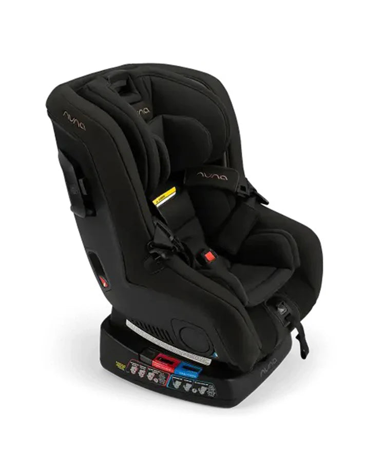 Angled side view of a Nuna black convertible car seat with contoured cushioning, five-point harness, ISOFIX base, and safety labels, designed for multi-stage child use and superior protection.