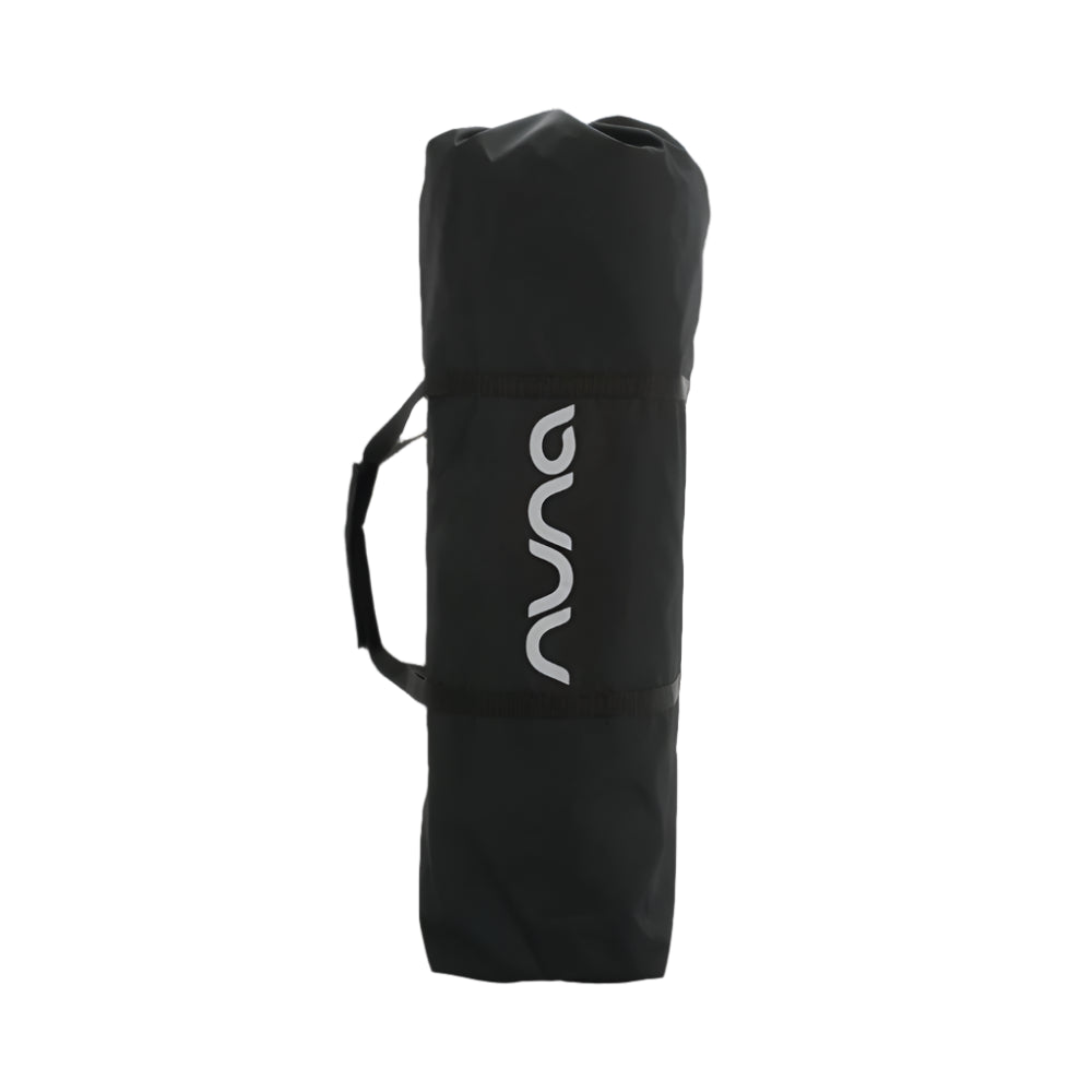 This is a black Nuna-branded carrying bag with a handle, designed for easy transport and storage of baby gear like a travel crib or bassinet.
