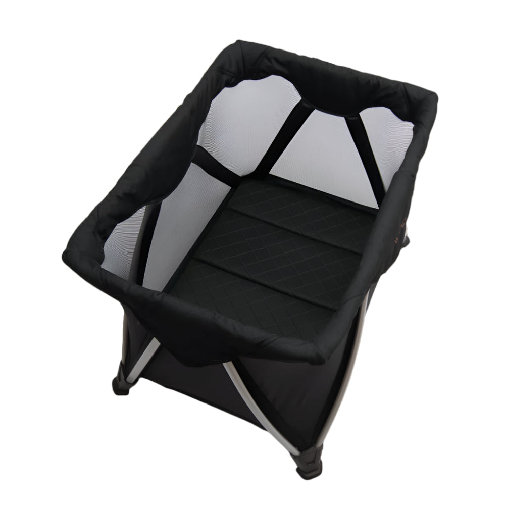 This is a black mesh-sided baby bassinet with a quilted black mattress and a sturdy foldable frame, offering a breathable and secure sleeping space for infants.