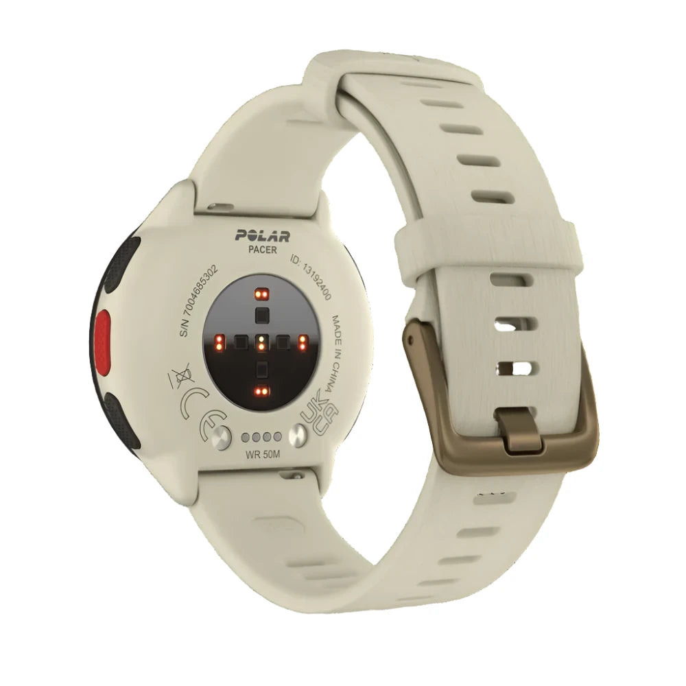 The back view of a Polar Pacer smartwatch with a white strap. The heart rate sensors and charging ports are visible on the back of the watch. The strap has a buckle closure and multiple adjustment holes for a secure fit. The watch’s branding and specifications are visible on the back casing, which also features a red button and black textured grips on the sides.
