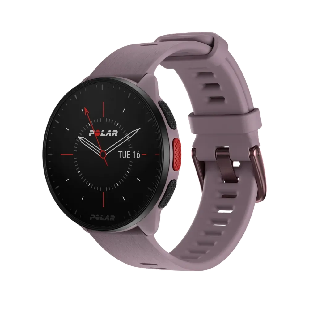 A Polar Pacer smartwatch with a round face displaying a traditional analog-style clock interface with white hour markers, red minute and second hands, and the date. The watch has a purple casing and a matching purple strap with a buckle closure.