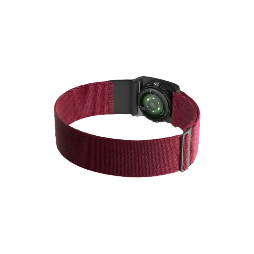 A Polar optical heart rate sensor with a black casing and a red adjustable strap. The sensor's back side is visible, showing the green optical heart rate monitoring lights. The strap is designed for secure fitment around the chest, with an adjustable buckle for a customized fit.