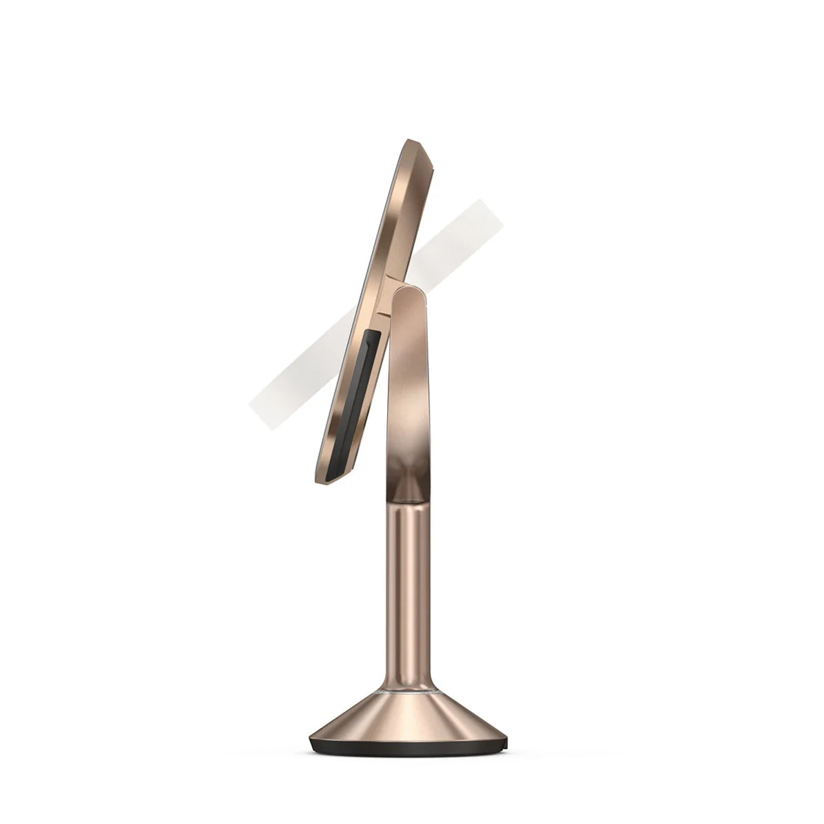 This image shows a side profile of the Simplehuman makeup mirror in a rose gold finish. The mirror is shown in a slightly tilted position, emphasizing its adjustable tilt feature, which allows users to customize the angle for optimal use during makeup application or grooming. The design is sleek and modern, with a thin, elegant frame surrounding the mirror. The stand is slender yet sturdy, tapering into a stable base that ensures the mirror remains secure on any surface. The rose gold color adds a luxuriou