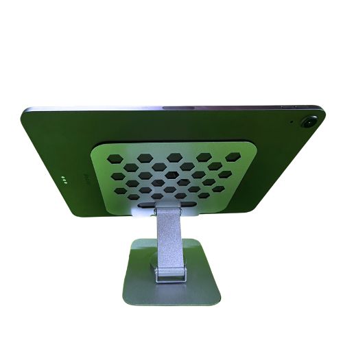 A back view of a tablet mounted on a white 360 rotating stand. The stand features a hexagonal cutout design on the base for ventilation or aesthetics and a sturdy adjustable arm that allows for various positioning and rotation angles. The tablet is securely held in place by the stand.