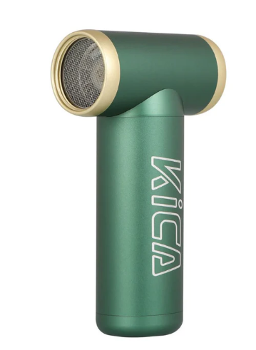 The image shows a KICA Jet Fan 2 in a green color with gold accents. The fan has a T-shaped design with a cylindrical fan unit at the top and a handle below. The brand name "KICA" is printed vertically on the side of the handle in white text. The green and gold color combination gives the fan a stylish and modern appearance, emphasizing its portability and functionality.