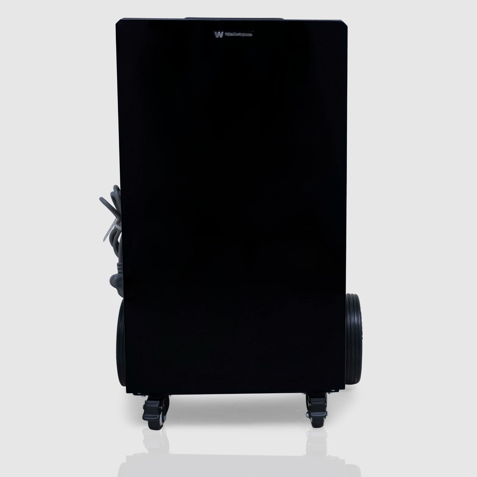 Front view of the White Westinghouse Industrial Dehumidifier WDE100, featuring a sleek black design with large rear wheels and front casters for easy mobility. The power cord is neatly wrapped on the side, making it ideal for large commercial and industrial spaces.