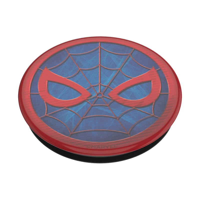  Angled view of a PopSockets Marvel Spider-Man PopGrip for MagSafe featuring Spider-Man's mask design. The mask is red with blue webbing details and red eyes, set against a blue background. The circular emblem has fine web lines connecting the mask elements and a small "© MARVEL" inscription at the bottom. The PopGrip base is black.