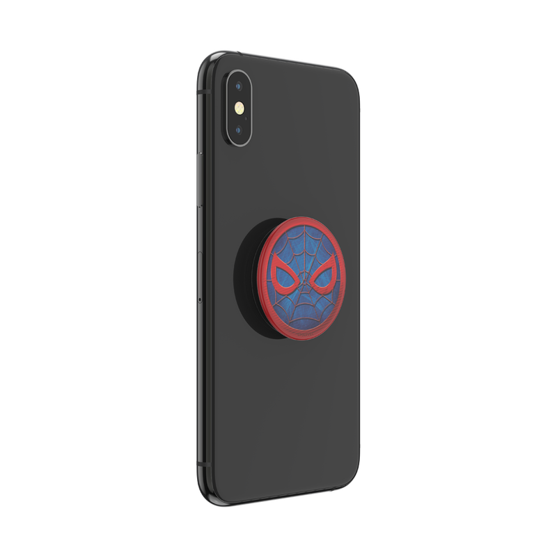 Black smartphone with a PopSockets Marvel Spider-Man PopGrip for MagSafe attached to the back. The PopGrip features Spider-Man's mask design with red webbing details and red eyes on a blue background. The phone is shown from the back at a slight angle, highlighting the PopGrip.