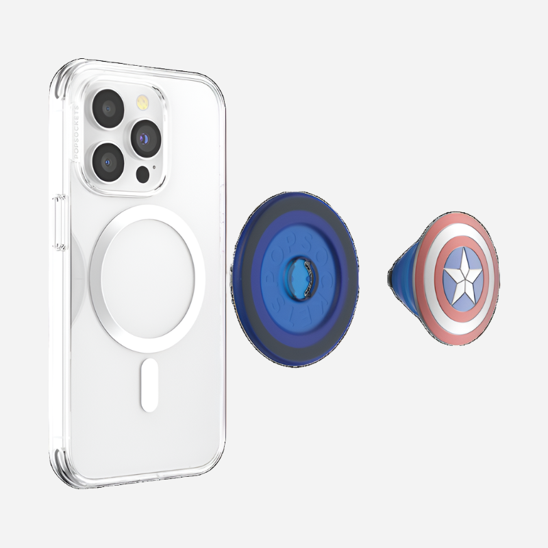  Clear smartphone case with an empty MagSafe ring attached to the back, shown alongside a detached Enamel Captain America PopGrip for MagSafe. The PopGrip, styled like Captain America's shield with concentric red, white, and blue circles and a white star in the center, is positioned to the right of the case. The PopGrip base is blue. The items are displayed on a white background.