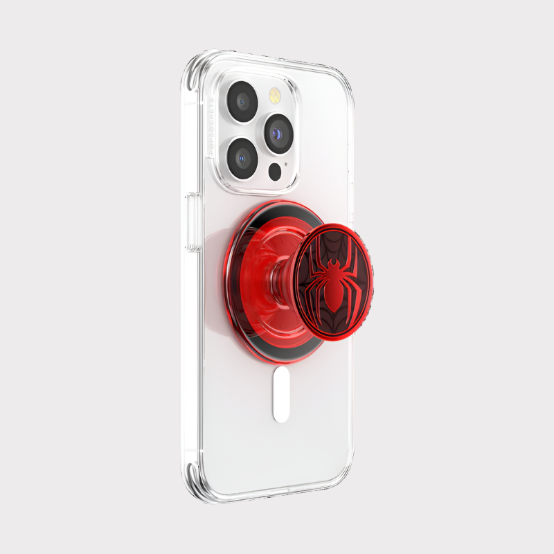 A clear smartphone case with an attached Enamel Miles Morales Suit PopGrip for MagSafe. The PopGrip is extended, showing its red and black design with the Miles Morales Spider-Man emblem in the center. The phone case has a camera cutout and the PopGrip is centrally positioned on the back. The glossy finish of the PopGrip highlights the distinctive Spider-Man design.