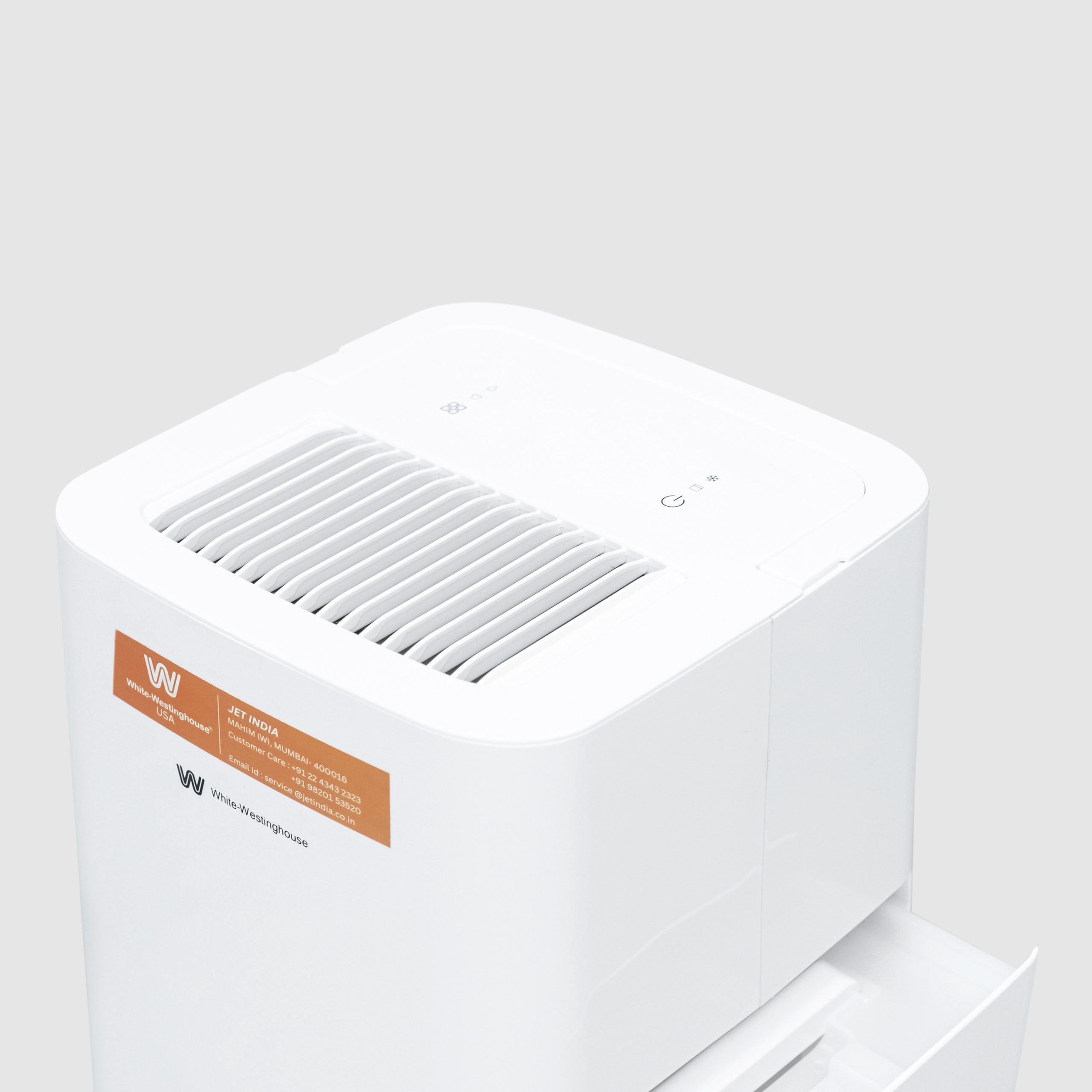 Top angled view of the White Westinghouse Dehumidifier AWHD123L, showcasing the air vent, control panel, and sleek white design. The unit is suitable for maintaining optimal humidity levels in residential and commercial spaces.
