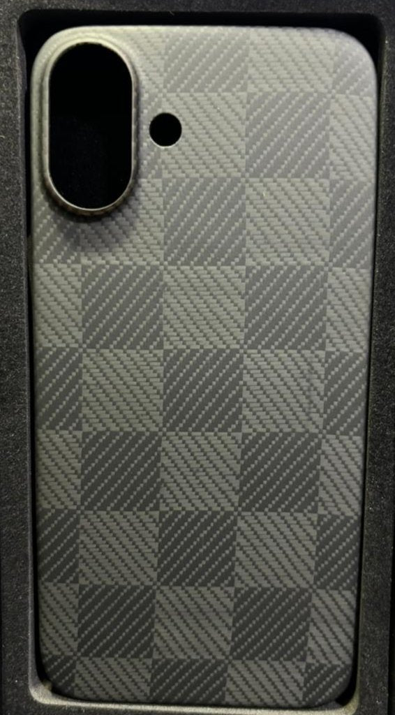 This image shows a smartphone case with a checkerboard carbon fiber-like texture, giving it a sleek, modern look. It has cutouts for a single rear camera and a microphone or flash. The design appears minimalistic and sturdy, offering both style and protection. Unlike the previous case, this one doesn’t have visible markings or indicators for MagSafe compatibility, focusing on a clean aesthetic.