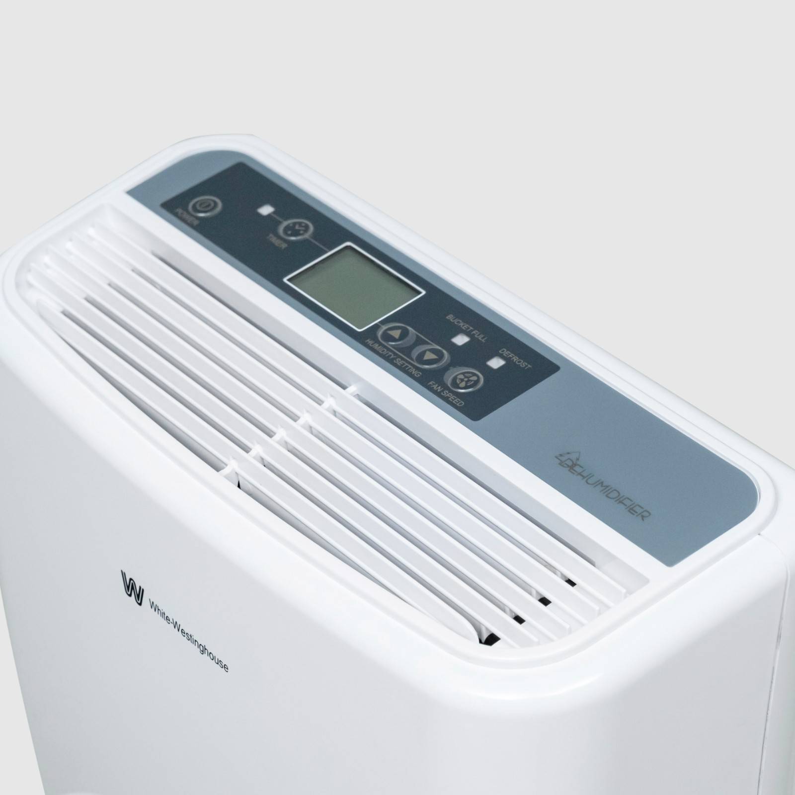 Close-up view of the top of the White Westinghouse Dehumidifier AWHD20L, showcasing the digital control panel and air vents. The sleek white design includes intuitive buttons for easy operation and precise humidity control, ideal for maintaining optimal humidity levels in residential and commercial spaces.