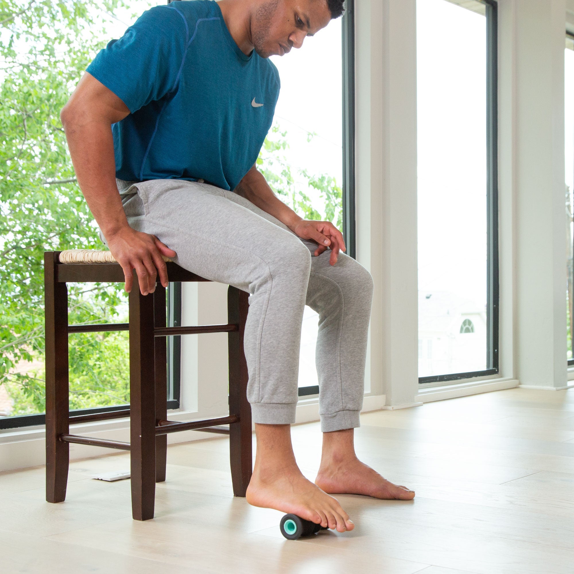Chirp 2 inch Foot Roller in use while seated at home