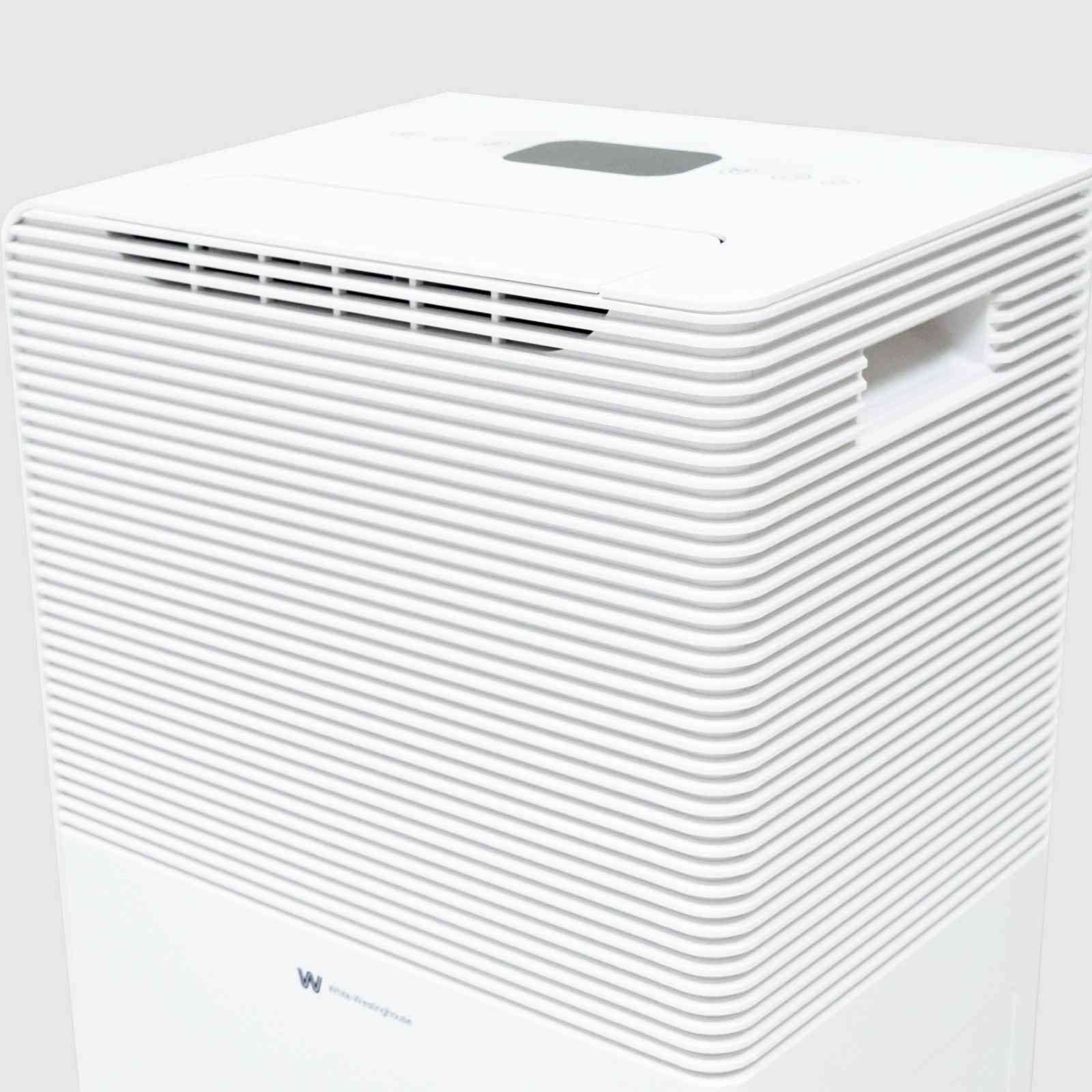 Top angled view of the White Westinghouse Dehumidifier AWHD40, showcasing the air vents, digital control panel, and built-in handle for easy mobility. The sleek white design is suitable for maintaining optimal humidity levels in residential and commercial spaces.
