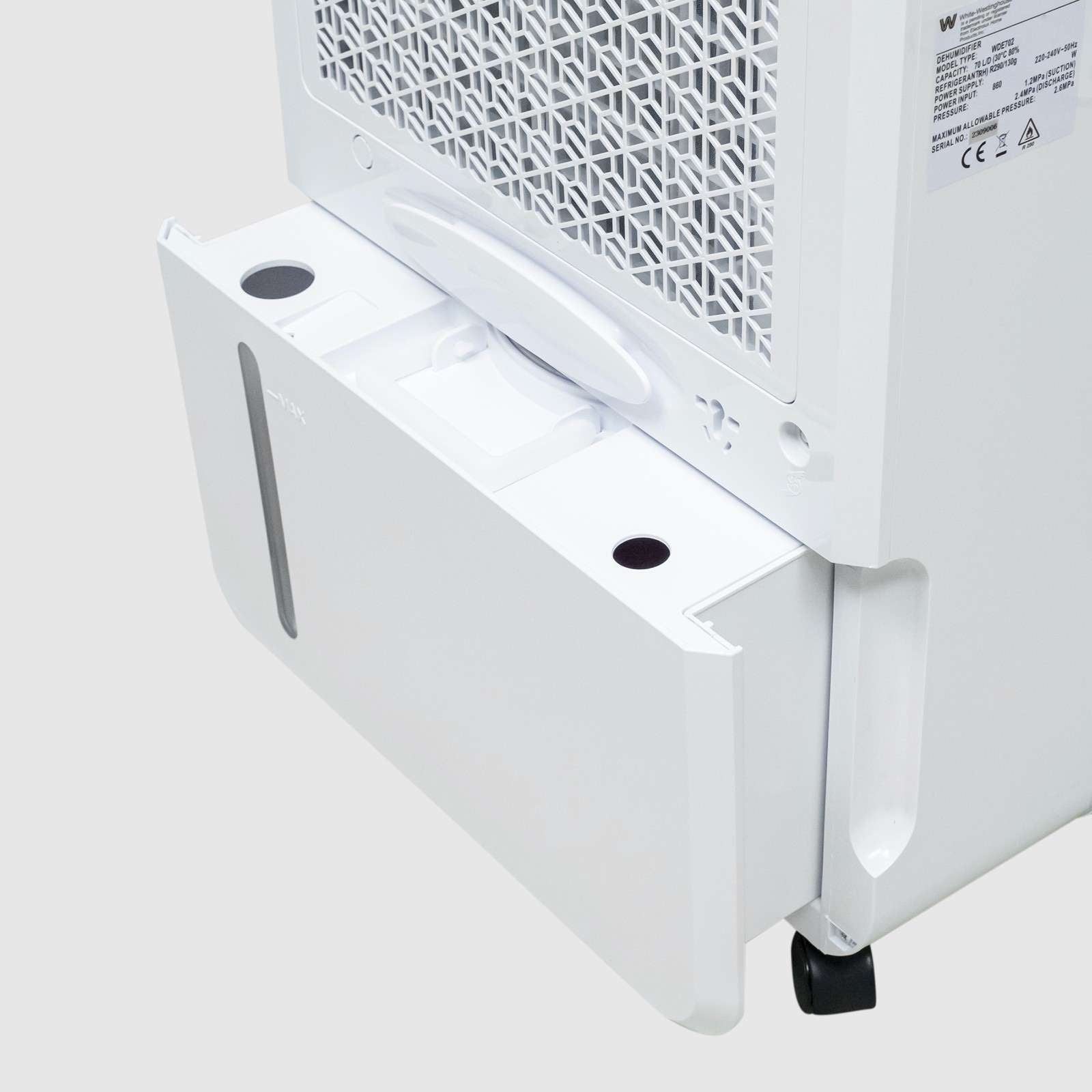 Close-up view of the White Westinghouse Dehumidifier WDE702 with the water tank partially removed, showcasing the easy-access water tank compartment and back air vent. The sleek white design is suitable for maintaining optimal humidity levels in residential and commercial spaces.