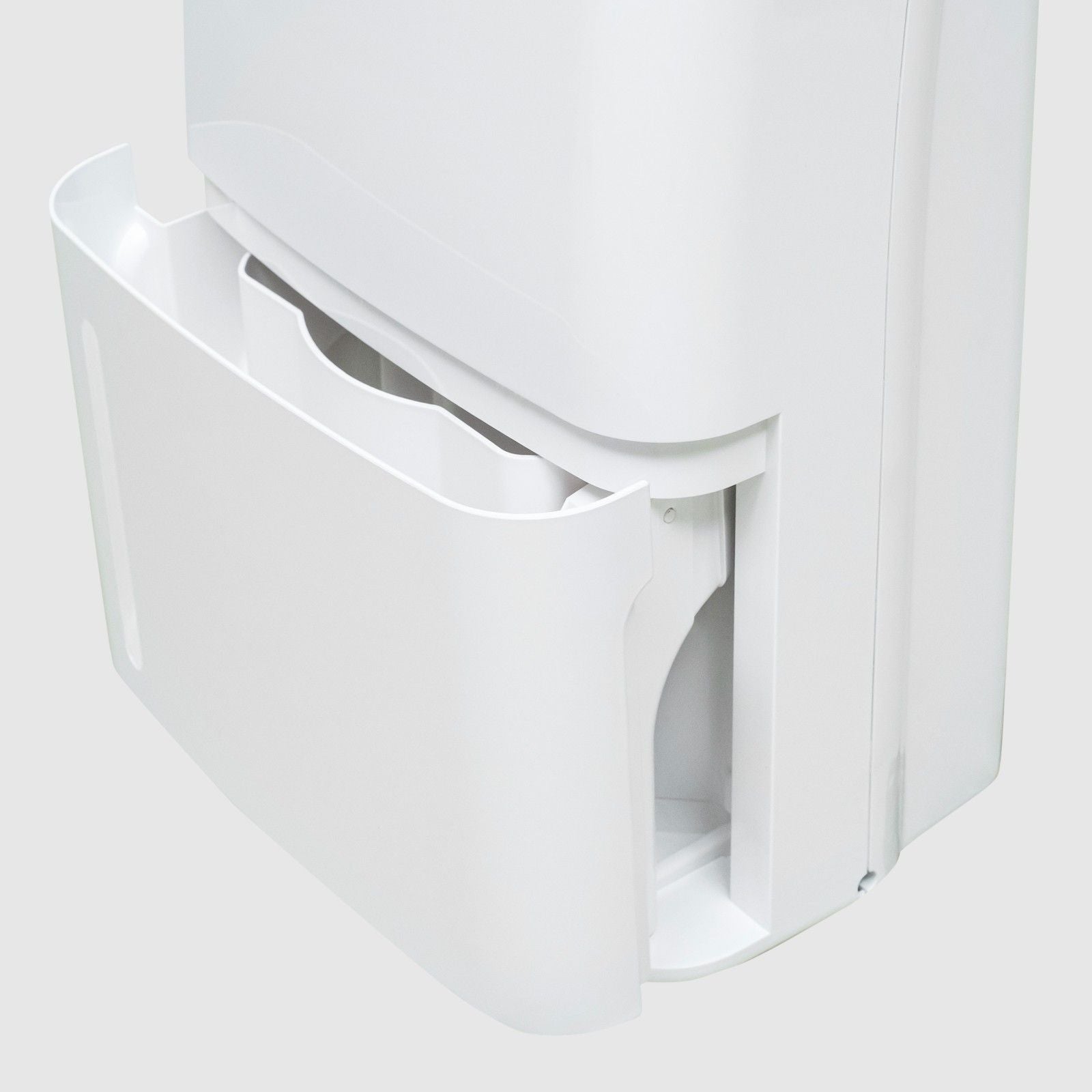 Close-up view of the White Westinghouse Dehumidifier WDE702 with the water tank partially removed, showcasing the easy-access water tank compartment. The sleek white design is suitable for maintaining optimal humidity levels in residential and commercial spaces.