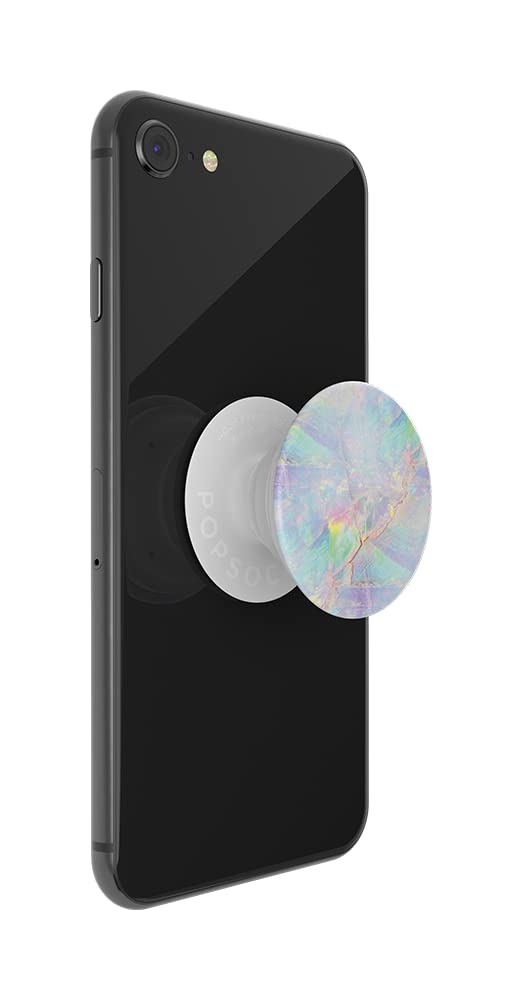 A black smartphone with a PopSockets Phone Grip with Expanding Kickstand in the Opal design attached to the back, shown in an extended state. The grip features an iridescent pattern with pastel colors such as pink, blue, green, and yellow, giving it a gemstone-like appearance. The grip's base is white, which complements the opal design and contrasts with the black phone, adding a touch of elegance and functionality.