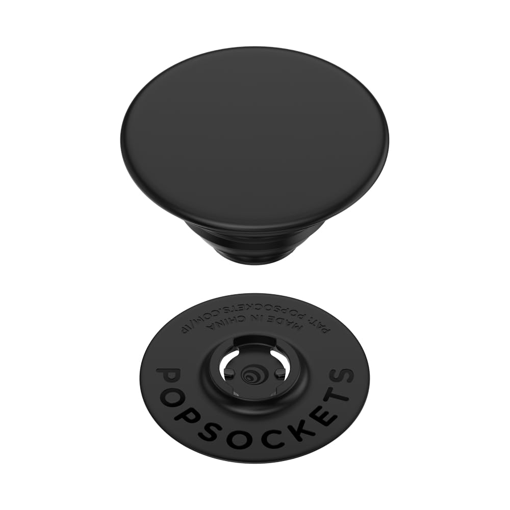  A black PopSockets Phone Grip with Expanding Kickstand shown in two pieces: the top part and the base. The top part is a smooth, circular grip, while the base has "PopSockets" embossed around the edge and a connection mechanism for attaching the grip. The sleek, minimalist design provides a functional and stylish accessory for holding and supporting a smartphone