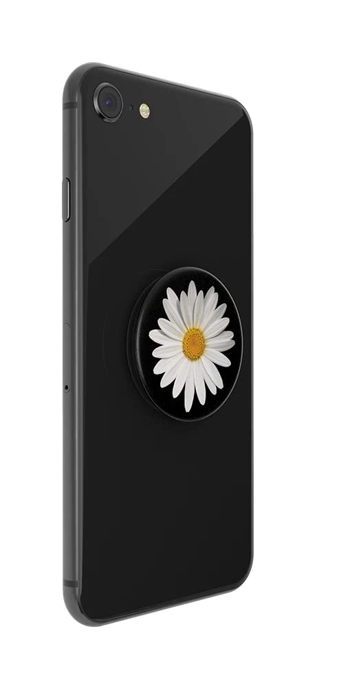 A black smartphone with a PopSockets phone grip attached to the back. The PopSockets grip features a white daisy with a yellow center, set against a black background. The daisy design is prominently displayed, adding a touch of floral elegance to the phone's sleek appearance.