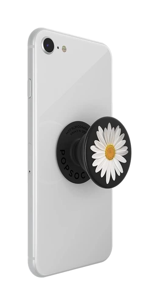 A white smartphone with a PopSockets phone grip attached to the back. The PopSockets grip is expanded and features a white daisy with a yellow center on a black background. The expanded grip is labeled "POPSOCKETS" around the base, providing added functionality for holding the phone securely.