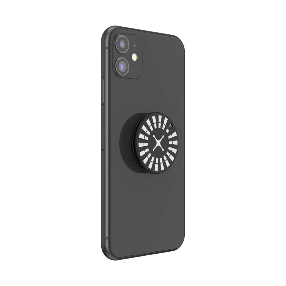 A black smartphone with a PopSockets Backspin Roulette grip attached to the back. The grip features a black circular top with white segments arranged like a roulette wheel and a red segment marked with the number "7". The center of the design has a white cross-like shape. The phone is positioned at an angle, showing the grip in its expanded form for easy holding.