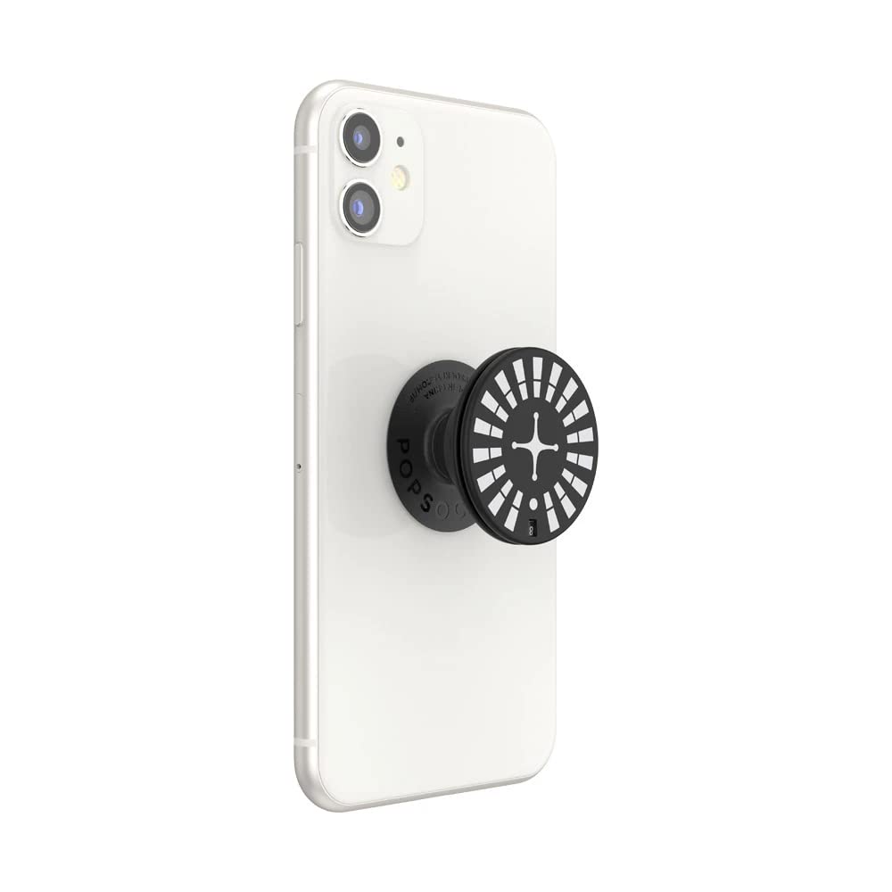  A white smartphone with a PopSockets Backspin Roulette grip attached to the back. The grip features a black circular top with white segments arranged like a roulette wheel and a red segment marked with the number "7". The center of the design has a white cross-like shape. The grip is shown in its expanded form, providing a secure hold on the phone. The side view displays the "PopSockets" branding on the base of the grip.