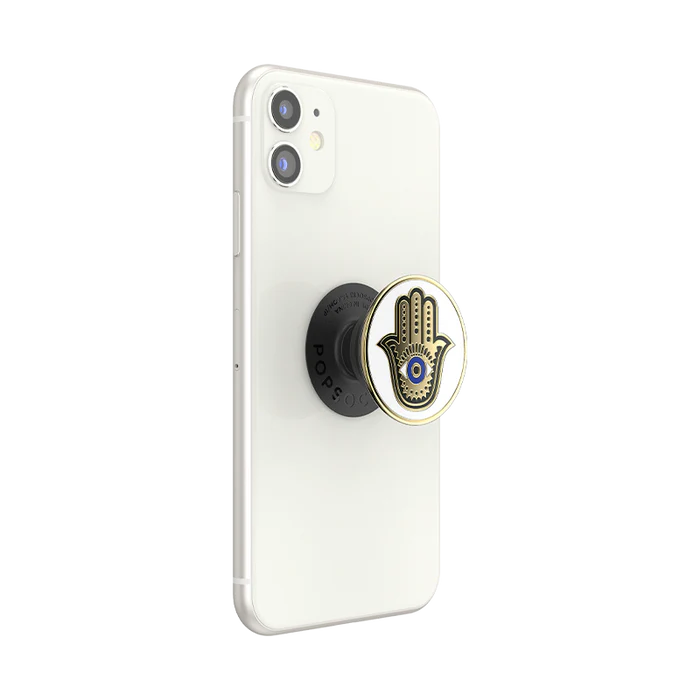  A white smartphone with a PopSocket attached to the back. The PopSocket features a design of a Hamsa hand with an eye in the center.