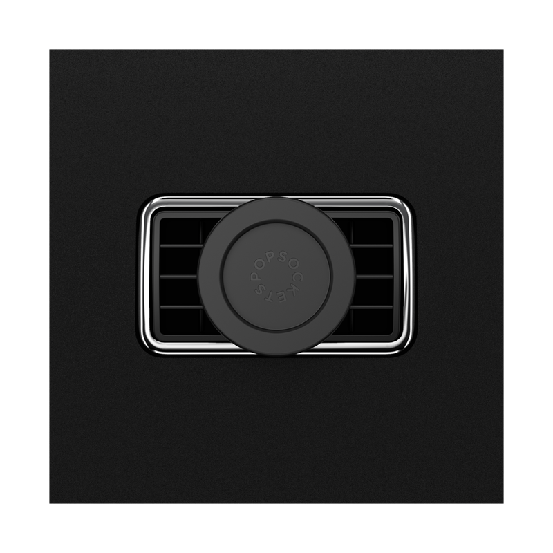  A Black MagSafe Car Vent PopMount 2 is shown attached to a car's air vent. The mount features a circular design with the PopSockets logo embossed on the inner surface. The black finish of the mount matches the air vent, creating a sleek and integrated look. The air vent has a chrome trim around it, adding a touch of elegance to the setup. The mount is securely attached, providing a stable platform for holding a MagSafe-compatible device for hands-free use while driving.