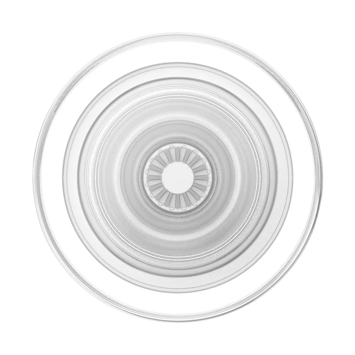  A close-up view of a PopSockets Clear PopGrip for MagSafe, showing its transparent circular design. The central part of the PopGrip features a radiating pattern and a hollow core, highlighting the detailed structure. The outer ring is clear and smooth, emphasizing the sleek and minimalist design of the accessory.